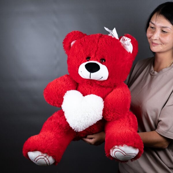 игрушка медведь красного цвета